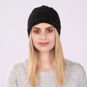Close-up of black fleece-lined knit beanie showing thick checkered texture and fur lining