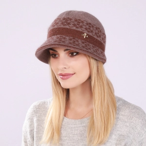 Close-up of winter knit hat with fleece lining and elegant insect-shaped jewelry brooch