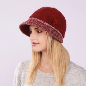 Detail of wine red knit cloche hat with floral accent and warm fleece lining for women