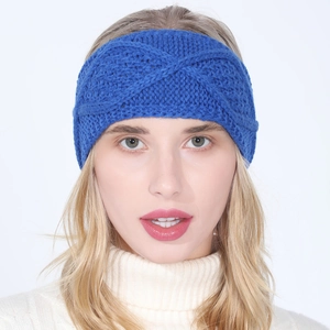 Royal blue knitted headband for women with a classic twist knot and thick cable knit texture
