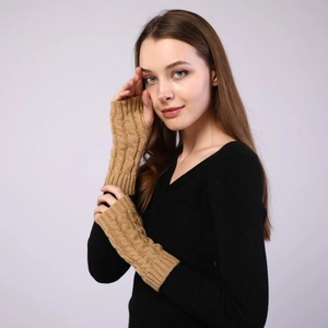 Detailed cable knit pattern on warm camel fingerless arm warmers for autumn and winter