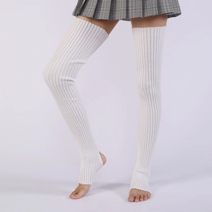 Detailed knit texture of white over-the-knee stirrup leg warmers with vertical ribbing