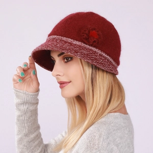 Close-up of wine red wool cloche hat with floral detail and textured knit brim