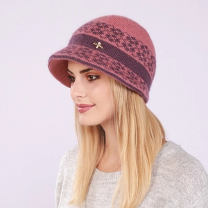 Detail of pink knitted hat featuring geometric patterns and a gold bee rhinestone accessory