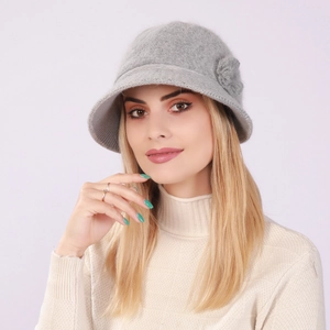 Close-up of grey knitted flower bucket hat with warm fleece lining for women
