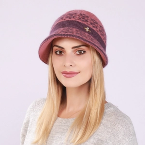Close-up of pink knit visor hat with floral pattern and golden bird metal brooch