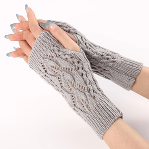 Detailed knit pattern of light gray fingerless gloves with elegant cable stitching