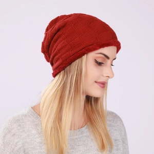 Close-up of deep red checkered knit hat with thick fleece lining for winter warmth