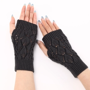 Detailed close-up of dark grey knitted fingerless gloves with hollow leaf pattern design