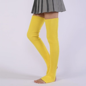 Detail of yellow ribbed knit over-knee leg warmers with stirrup design for yoga
