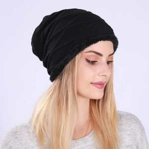 Women's black knitted winter beanie with fleece lining and diagonal ribbed texture