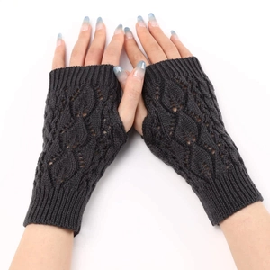 Close-up of dark grey knit fingerless gloves with leaf pattern and cable knit texture