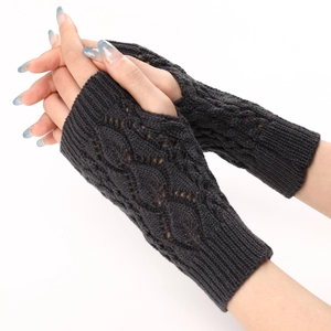 Detail of dark grey knit fingerless gloves with hollow leaf pattern and ribbed cuffs