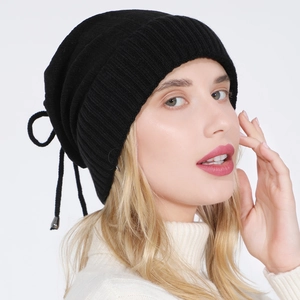 Women's black ribbed knit beanie with adjustable drawstring and silver metal toggle