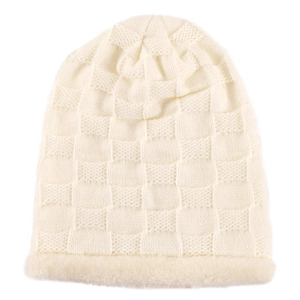 Detailed close-up of cream knit beanie with checkerboard pattern and faux fur lining