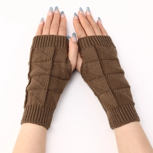 Close-up of brown knitted fingerless gloves with a textured diamond pattern for warmth