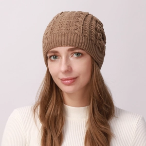 Close-up of khaki cable knit hat featuring thick warm yarn and ribbed elastic brim