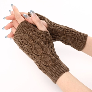 Detail of dark brown cable-knit fingerless gloves featuring hollow leaf patterns