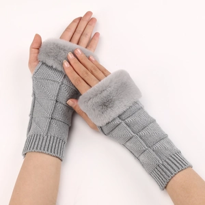 Detailed knit texture and faux fur trim on light grey fingerless gloves for winter