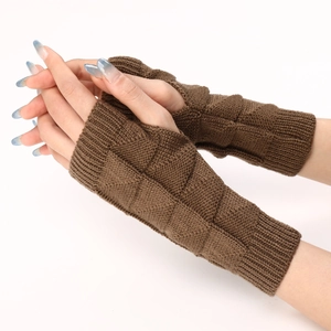Close-up of brown knit fingerless gloves with diamond patterns and ribbed cuffs detail