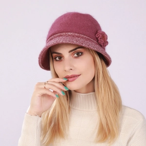 Close-up of winter knit cloche hat in plum red with floral detail and warm lining