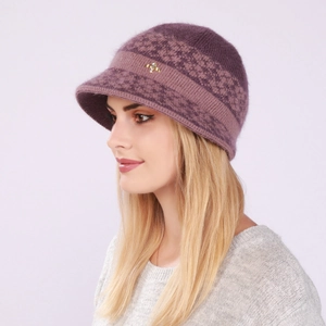 Detail of purple knitted wool hat featuring golden bow accessory and jacquard texture