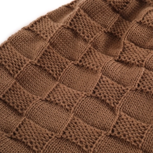 Close-up of deep brown waffle knit texture on a warm winter beanie for men and women