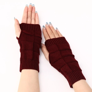 Detailed view of burgundy fingerless knit gloves with classic diamond pattern texture