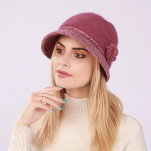 Detail of warm knitted bucket hat with flower decoration in dark purple for women