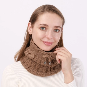 Detail of brown cable-knit neck warmer with adjustable drawstring and metal toggles