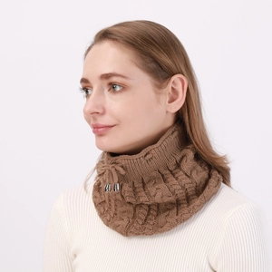 Detail of brown cable-knit neck warmer with silver adjustable drawstring buckle