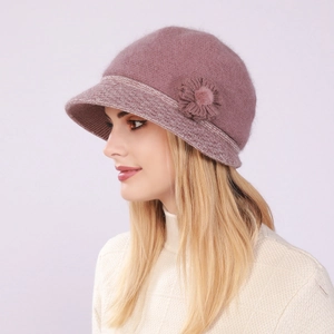 Detail of elegant purple knitted cloche hat with fuzzy texture and decorative flower
