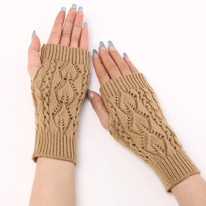 Close-up of camel knit fingerless gloves with hollow leaf pattern and ribbed cuffs