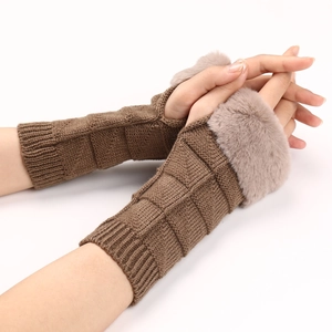Close-up of brown knit fingerless gloves with soft faux fur trim and grid texture