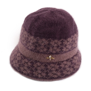 Detail of purple knit hat with fuzzy texture and golden bee jewelry embellishment