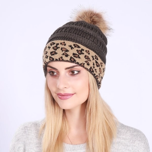 Women's brown winter knit beanie featuring a leopard print cuff and plush faux fur pom-pom