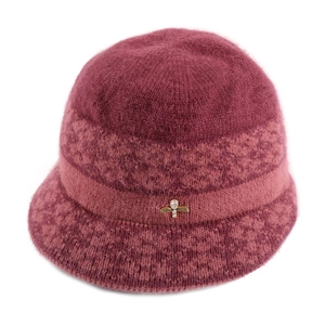 Detail of burgundy knit bucket hat with soft fur texture and golden bee rhinestone accessory