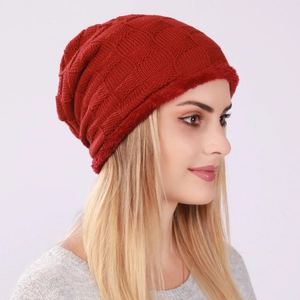 Red knit earflap hat for winter with checkered texture and faux fur trim for warmth
