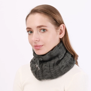 Detail of dark grey cable knit neck warmer with adjustable drawstring and metal tips
