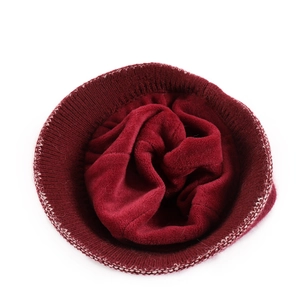 Detail of soft thickened fleece lining inside the burgundy knitted winter hat for warmth