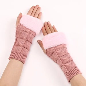 Detailed knit texture of pink fingerless gloves with soft faux fur trim for winter