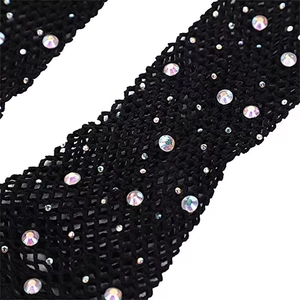 Detail of black fishnet fabric with iridescent AB rhinestones for party gloves