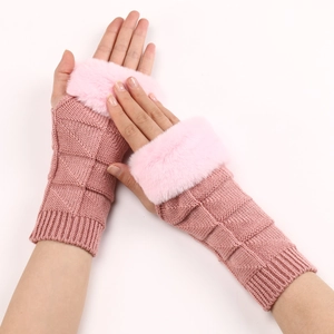 Detail view of pink knit fingerless gloves with soft faux fur cuffs and geometric pattern