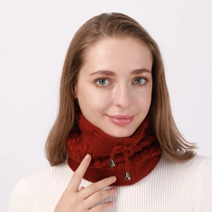 Detail of brick red cable knit neck warmer with adjustable drawstring and metal buckle
