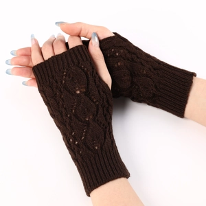 Close-up of dark coffee knit fingerless gloves with elegant cable stitch texture