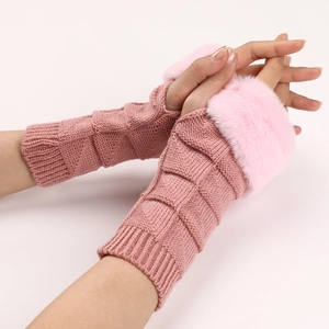 Close-up of pink knit fingerless gloves with checkered texture and faux fur cuffs