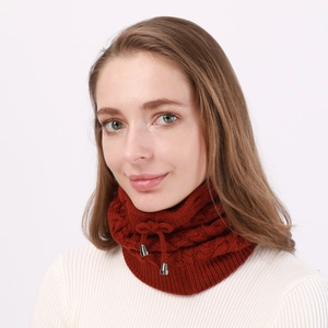 Detail of brick red cable knit neck warmer with adjustable drawstring and metal buckle