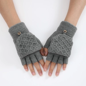Detail of grey knitted convertible gloves showing diamond pattern and fashion button
