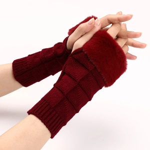Close-up of wine red cable knit fingerless gloves with soft faux fur cuffs for women