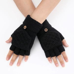 Detail of black knit fingerless gloves with flip top and fashion wooden button